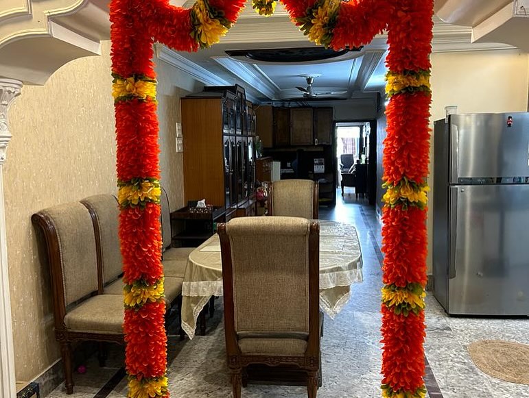 Festive Flower Garland and Bandanwar Collection, a festival décor piece, shown in a 8-image Instagram carousel. Image 5 of 8.